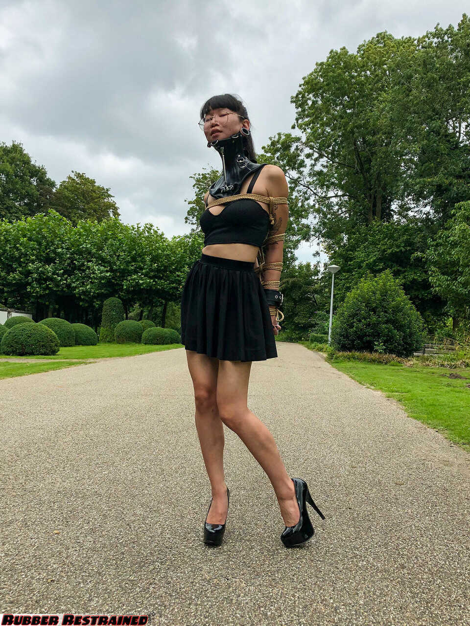 Neck-Collared Asian Flawless Meow in a BDSM Park Scene: Asian BDSM, Outdoor Bondage with High Heels and Glasses - Flawless...