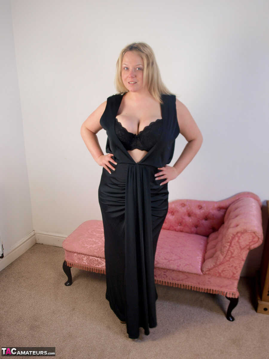 Plump blonde Sindy Bust gets naked on a chaise lounge in her stockings while enjoying a sexy chubby MILF moment with her a...