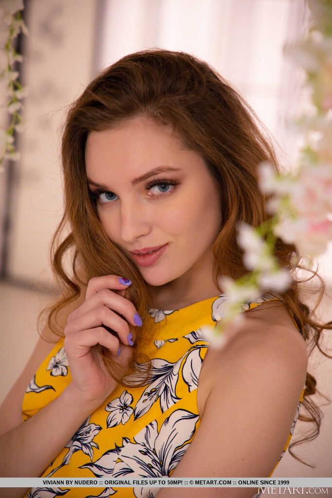 Petite teen Viviann strips down to her bare feet and exposes her tight pink pussy for the camera in a series of nude poses...