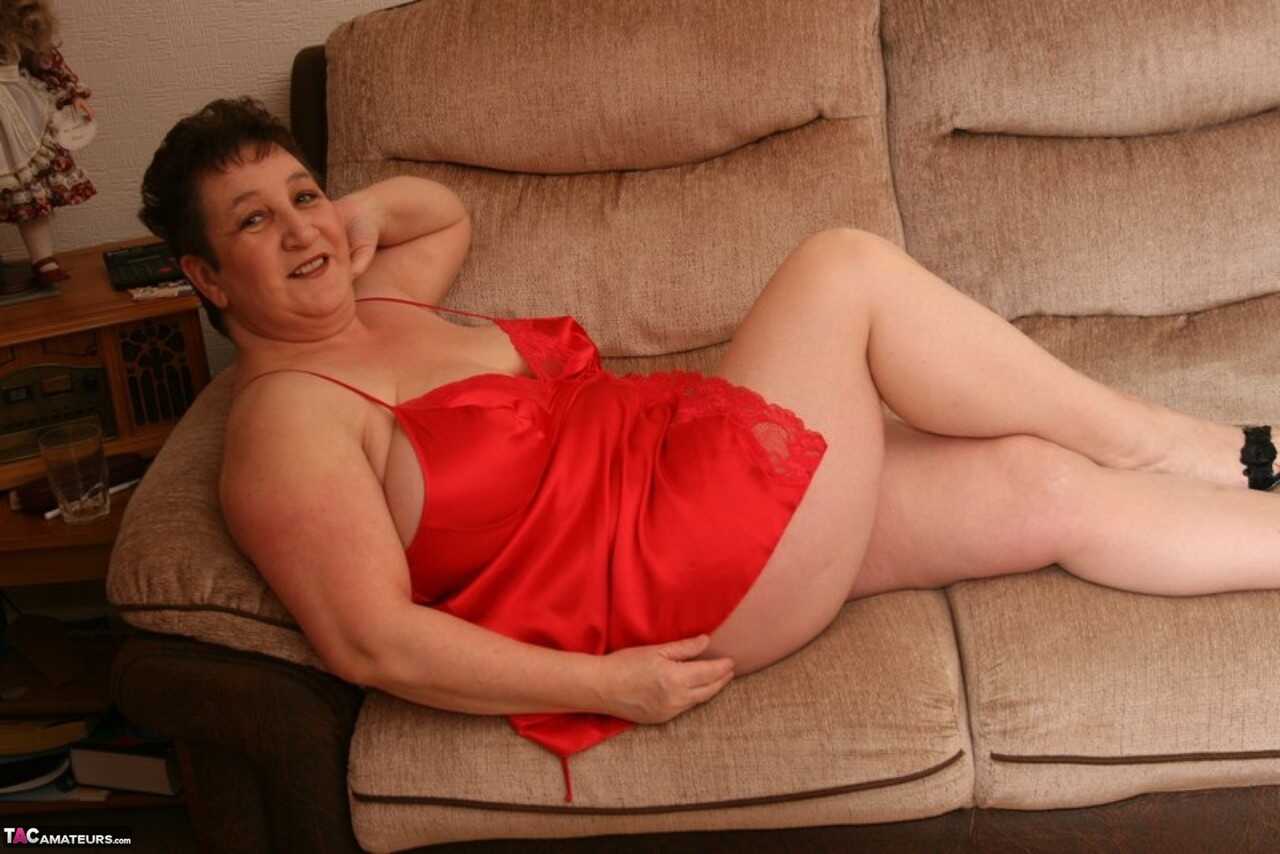 Overweight MILF Kinky Carol Unleashes Her Big Tits from Red Lace Lingerie