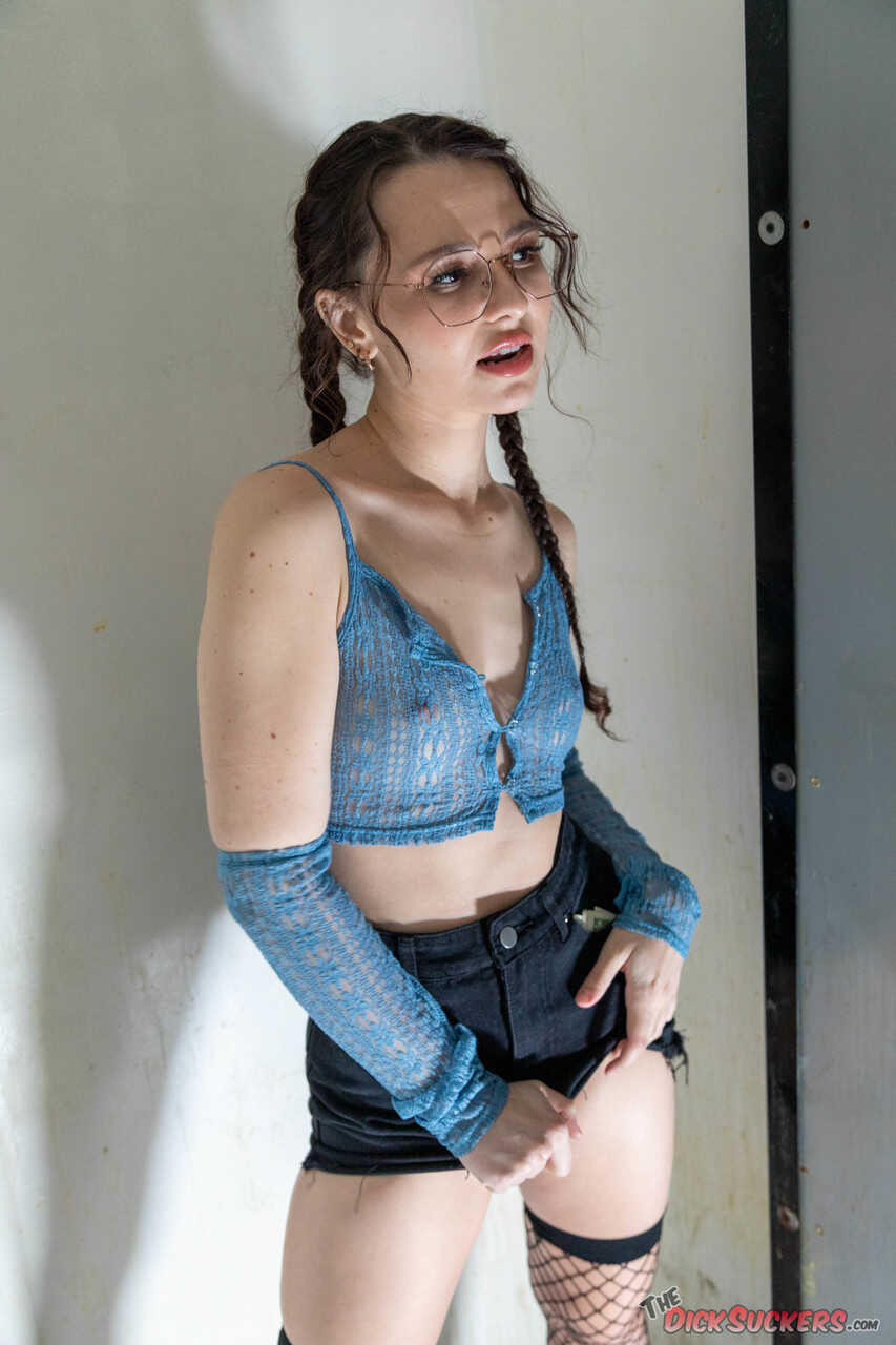 The nerdy teen Liz Jordan gets her glasses smudged while getting fucked by a gang in the adult video store - Liz Jordan