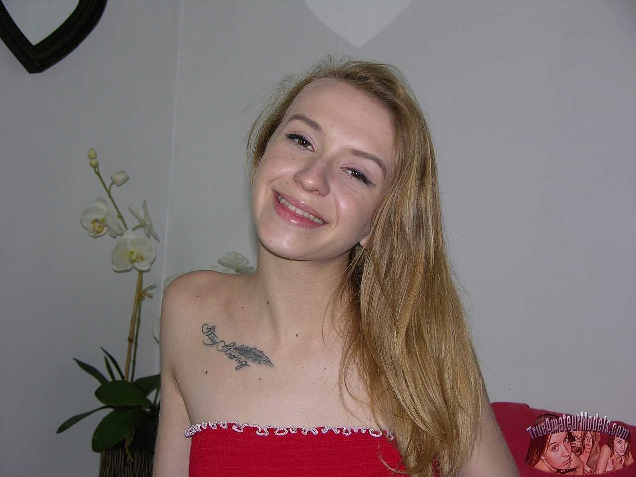 Blushing Kristy's Naked Debut: A Young Amateur Model's Tight Pussy Tats on Top of a Bed - Kristy