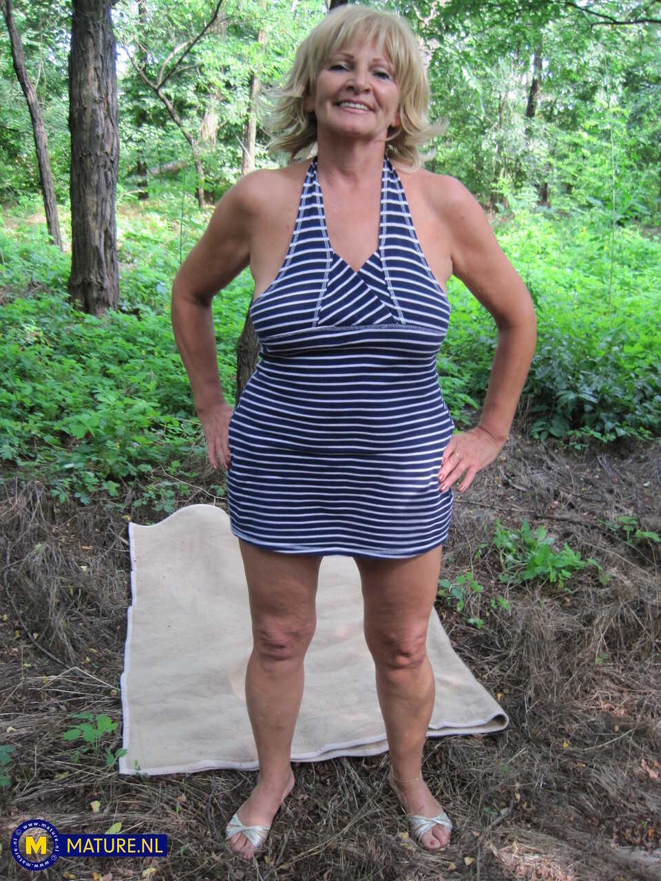 Mature blonde lady Sally G spreads her legs for a wild POV sex session on a blanket in the woods