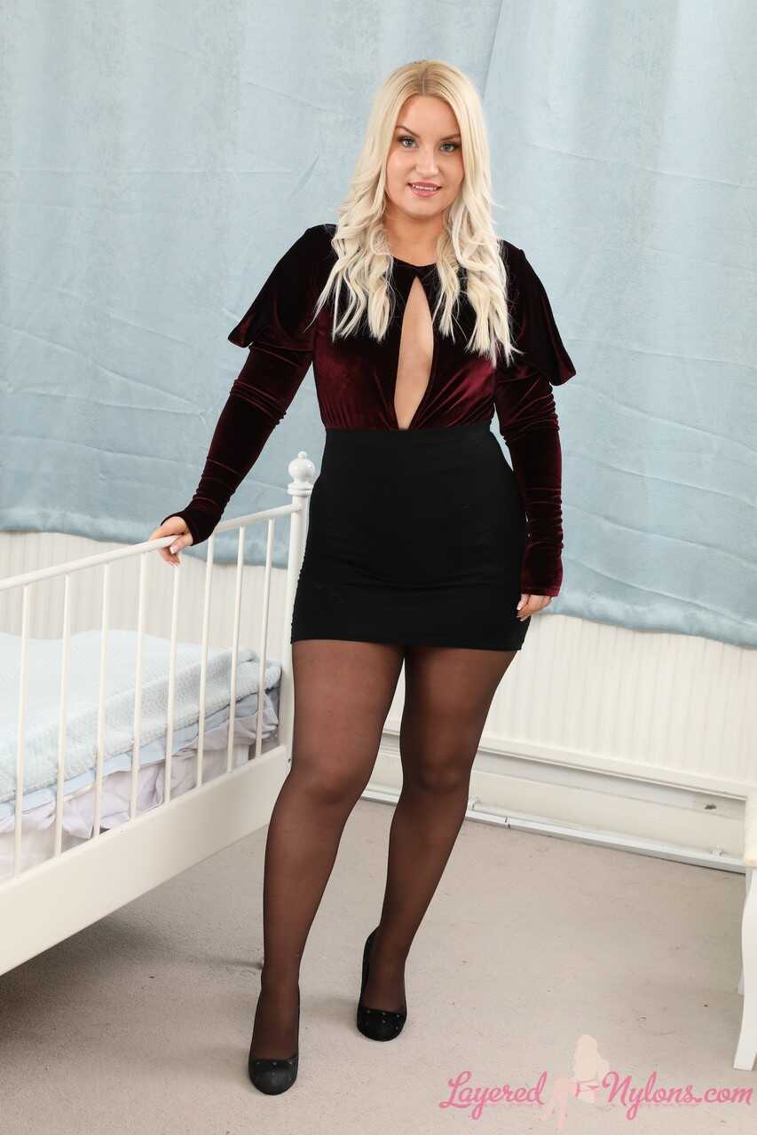 Thick blonde Irish Essie uncovers her tiny tits in pantyhose over stockings while discovering her chubby thighs and thick ...