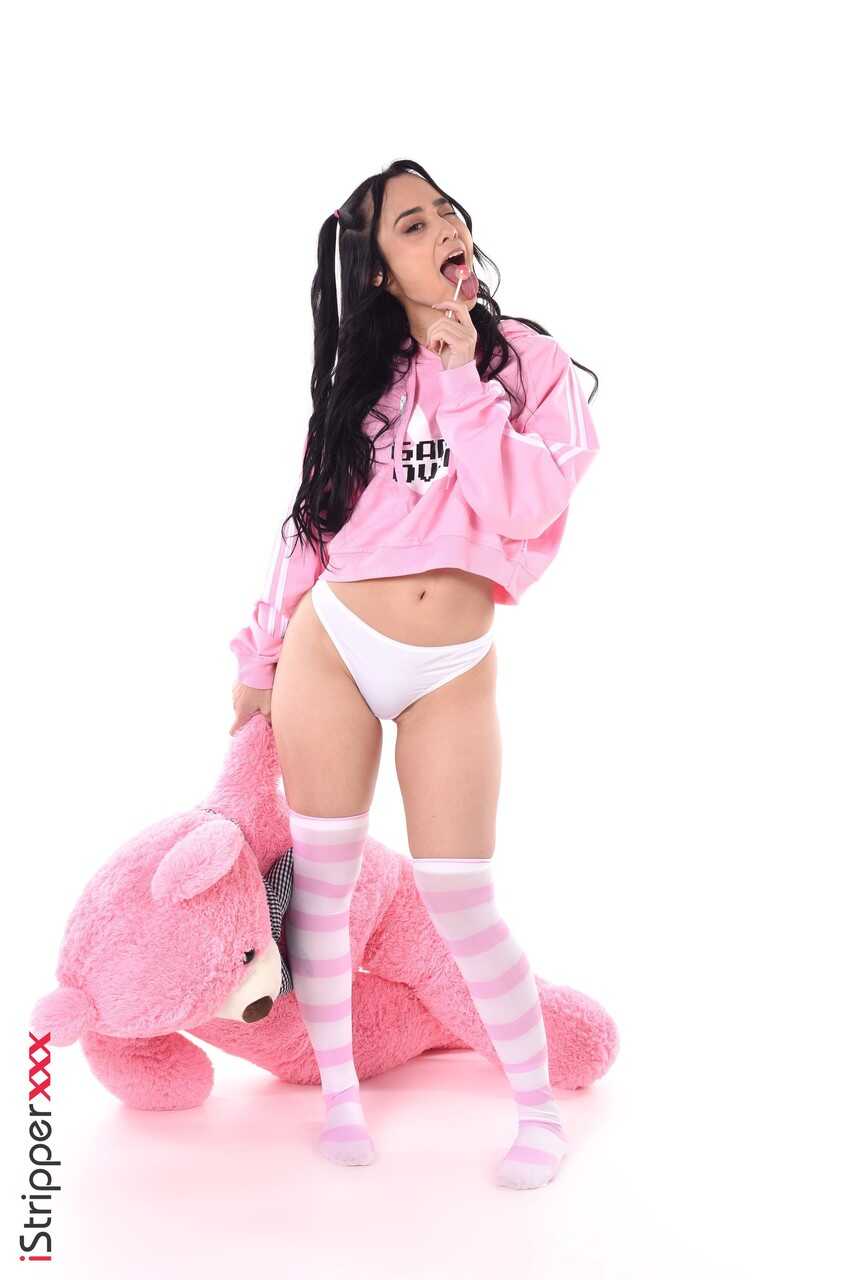 Stripping Alice Hernandez teases her big ass in thigh high socks and panties - Alice Hernandez