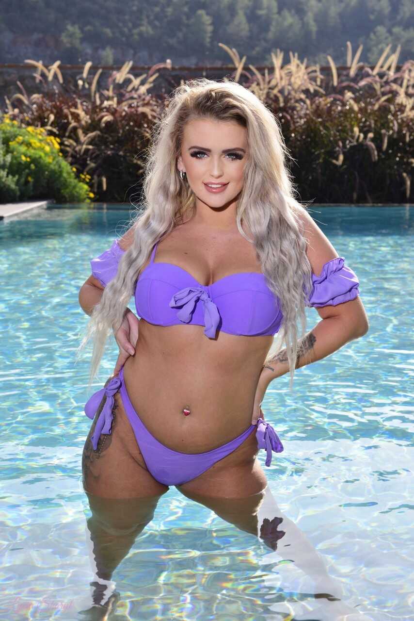 Platinum blonde Lycia Sharyl takes off her bikini while in a swimming pool