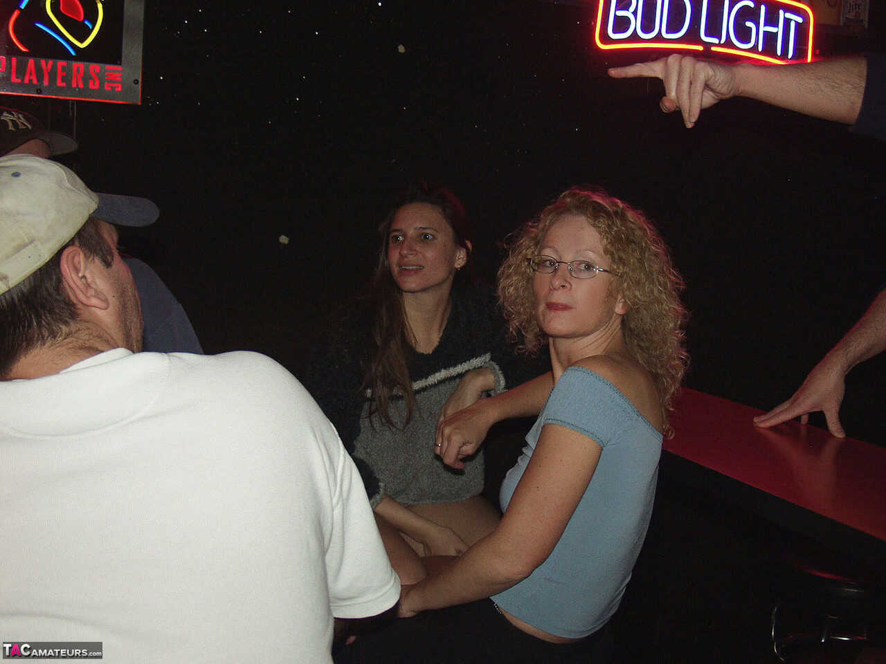 Ginger Klixen engages in public fisting with a nerdy MILF inside a hairy dive nightclub! - 