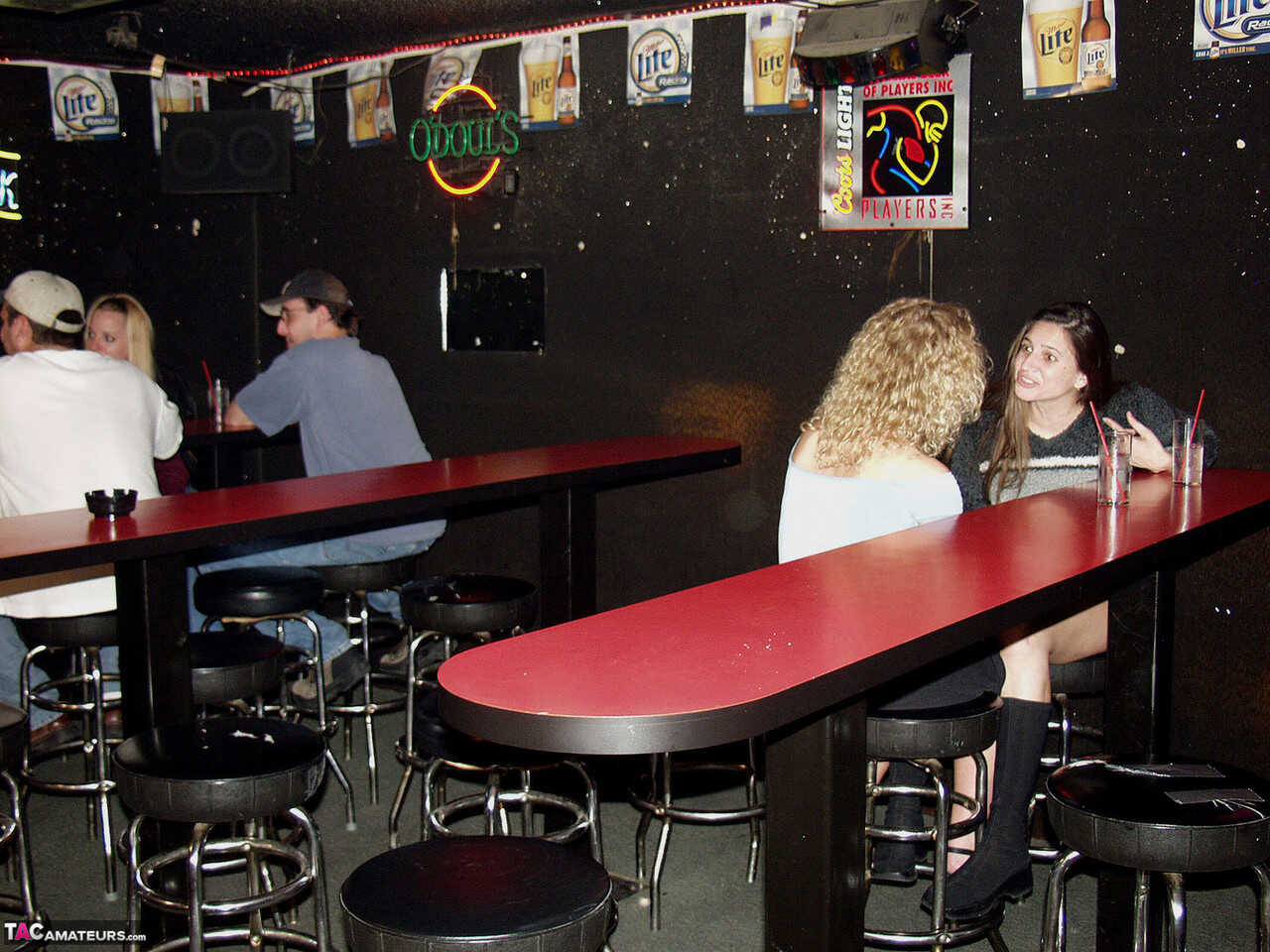 Ginger Klixen engages in public fisting with a nerdy MILF inside a hairy dive nightclub! - 