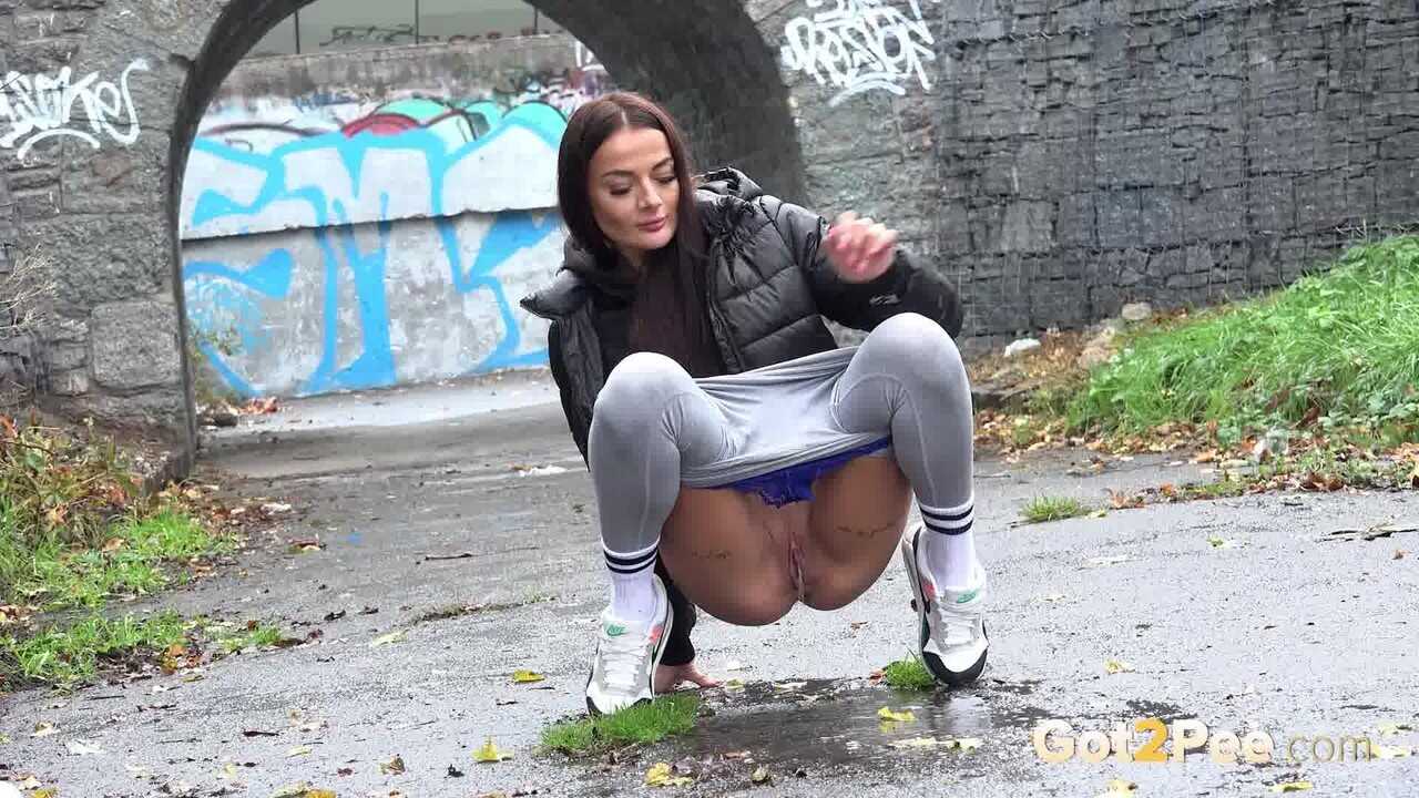 Peeing Maddi Black's Caucasian Girl Pussy on the Wet Pavement