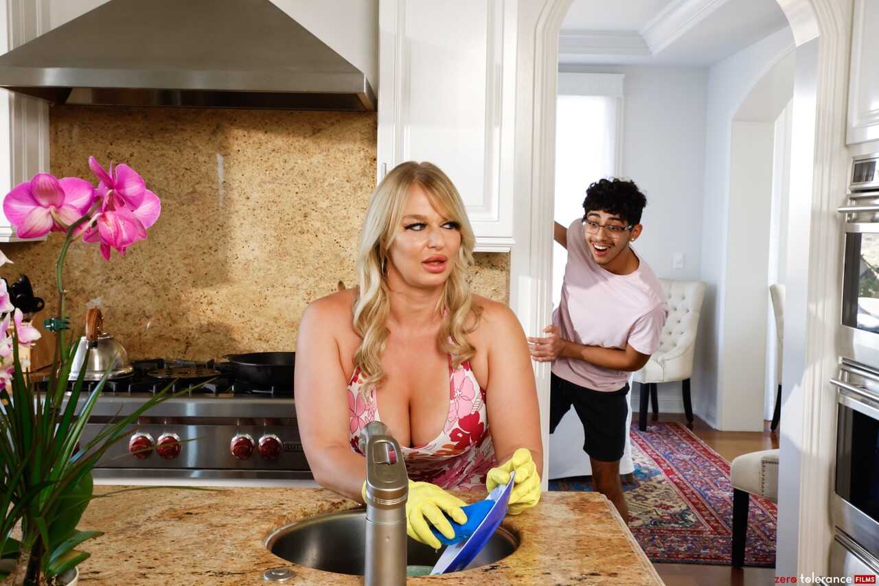 Busty blonde cougar London River sucks and fucks young stud Diego Perez in the kitchen while washing dishes - London River...
