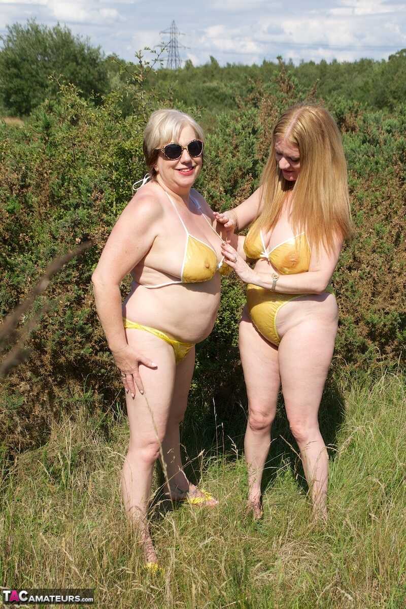 Mature UK lady Speedy Bee and her younger lesbian lover fondle each other in skimpy bikinis - Speedy Bee, Lily May