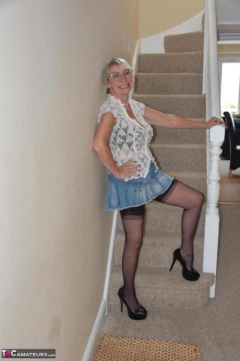Mature British Barby Slut shows off her big tits and spreads her wet snatch on the stairs in a series of explicit close-up...