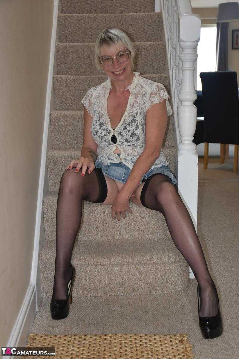 Mature British Barby Slut shows off her big tits and spreads her wet snatch on the stairs in a series of explicit close-up...
