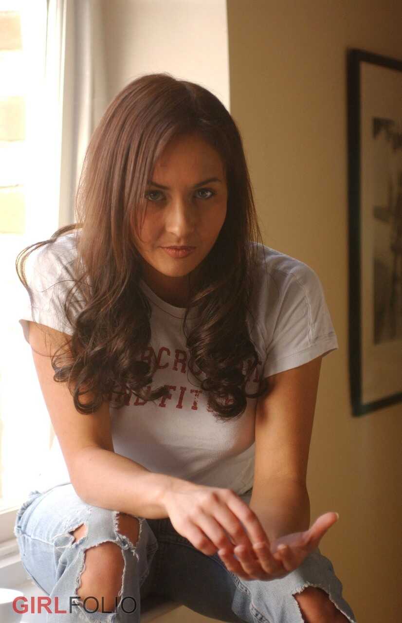 Jessica's Daring Topless Performance on a Window Ledge in Skin-Tight Jeans - Jessica