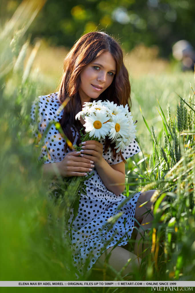 Nice young Elena Max wanders the fields in her birthday suit, picking flowers and playing with herself   Young Elena Max's shaven pussy and ass on display as she explores nature nude 