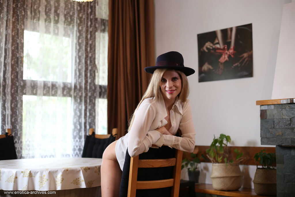 Blonde teen Valentina Love strips out of her black boots and shows off her natural beauty