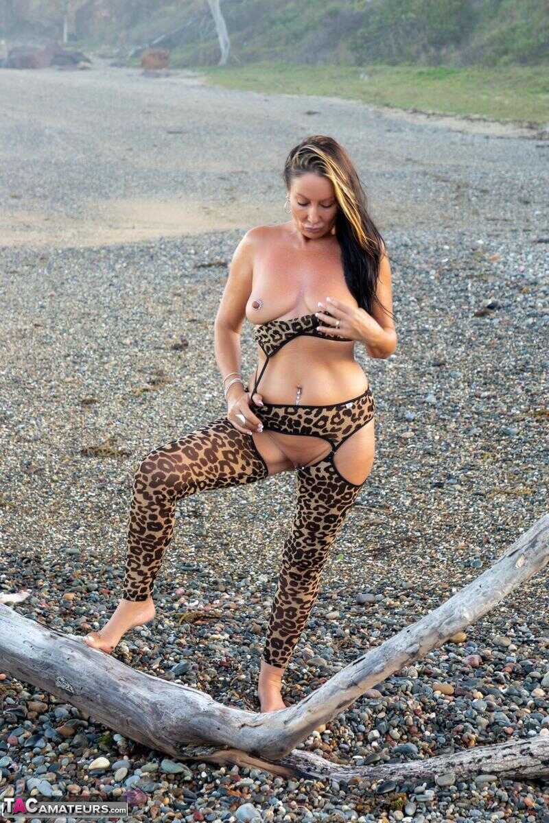 Sexy MILF Roxeanne's Driftwood Adventure Animal Print Hosiery and Nude Moments on the Beach! - Roxeanne