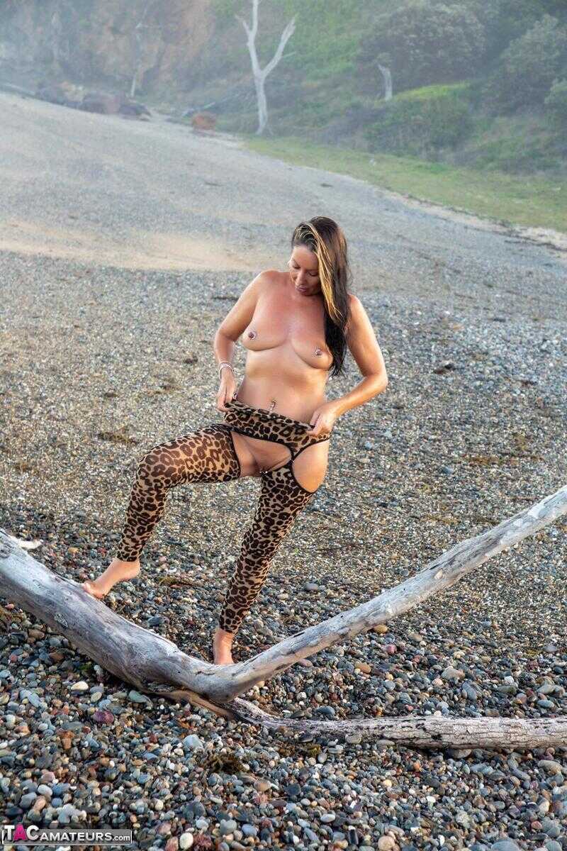 Sexy MILF Roxeanne's Driftwood Adventure Animal Print Hosiery and Nude Moments on the Beach! - Roxeanne