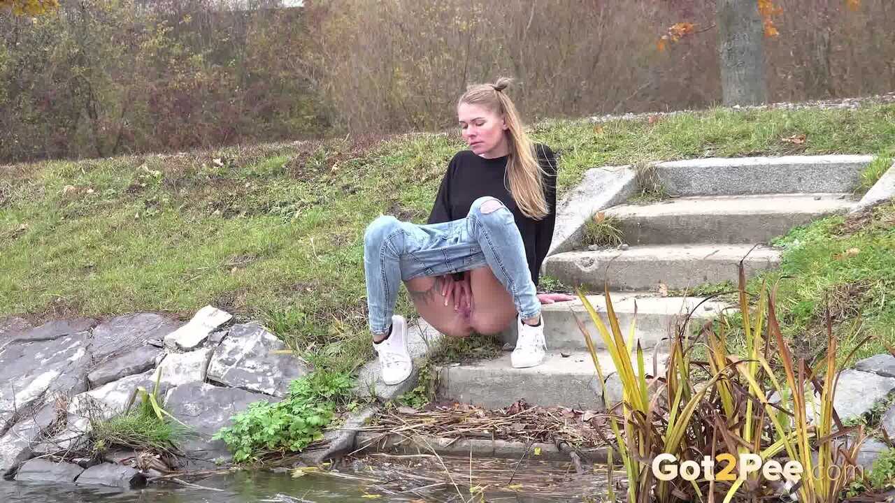 Claudia Macc's Jeans Pussy Descends Concrete Steps for a Public Pee with a View