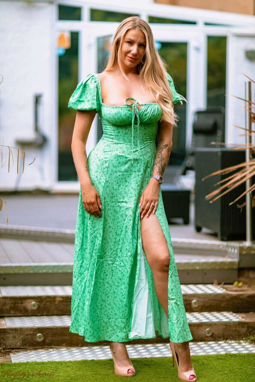 Towering UK blonde Danielle Maye unleashes her massive titties on a patio in high heels while wearing a tiny bikini and sh...