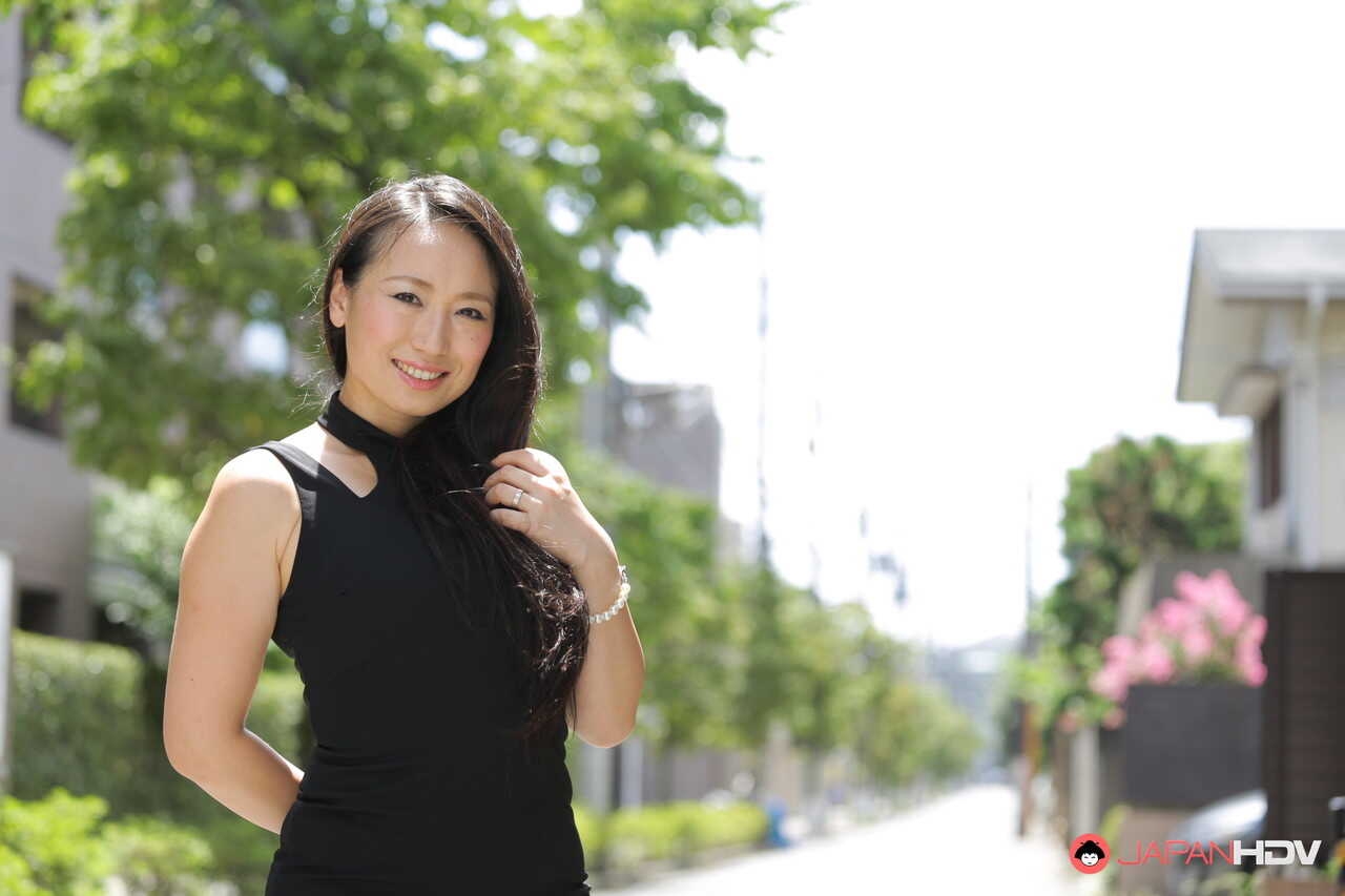 Public flashing with hot Japanese beauty Aya Shiina in a short black dress on a city street - Aya Shiina