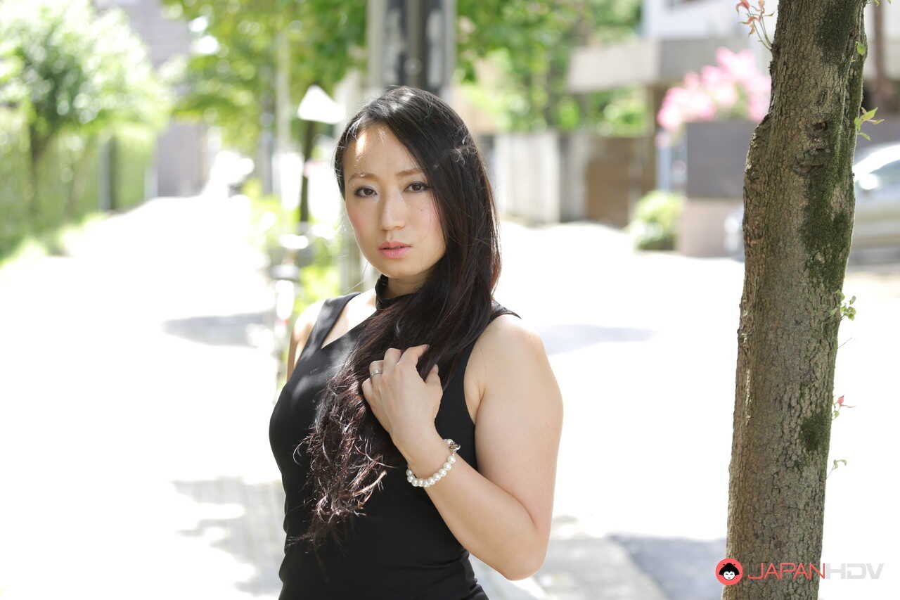 Public flashing with hot Japanese beauty Aya Shiina in a short black dress on a city street - Aya Shiina