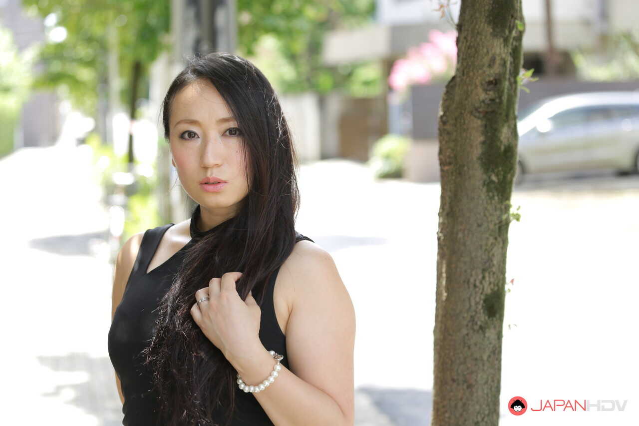 Public flashing with hot Japanese beauty Aya Shiina in a short black dress on a city street - Aya Shiina
