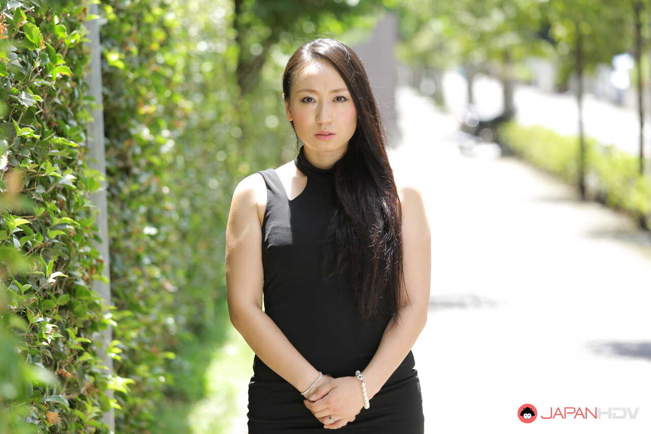 Public flashing with hot Japanese beauty Aya Shiina in a short black dress on a city street - Aya Shiina