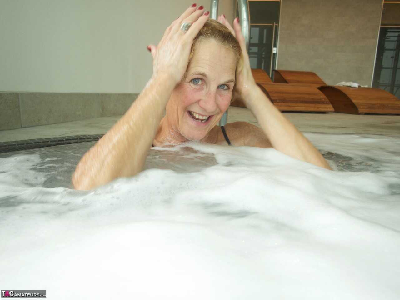 Sultry Molly in her Hot Tub, Sucking on a Popsicle While Wearing Her Micro Bikini - Molly Milf