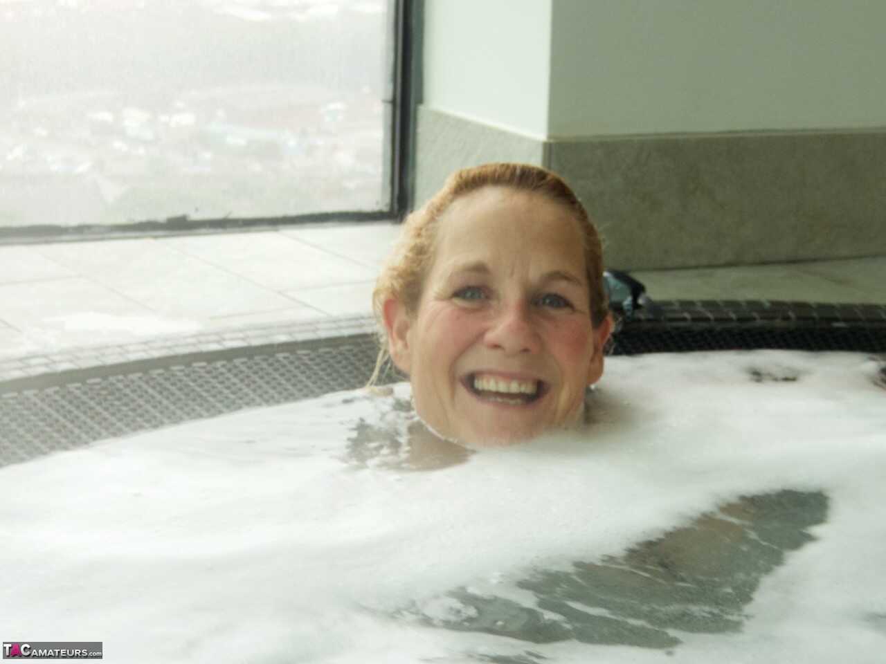 Sultry Molly in her Hot Tub, Sucking on a Popsicle While Wearing Her Micro Bikini - Molly Milf