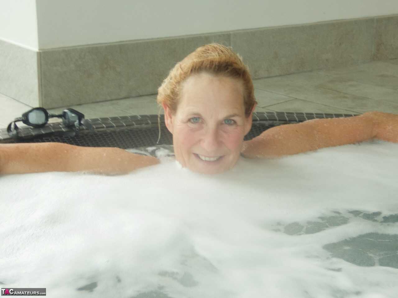 Sultry Molly in her Hot Tub, Sucking on a Popsicle While Wearing Her Micro Bikini - Molly Milf