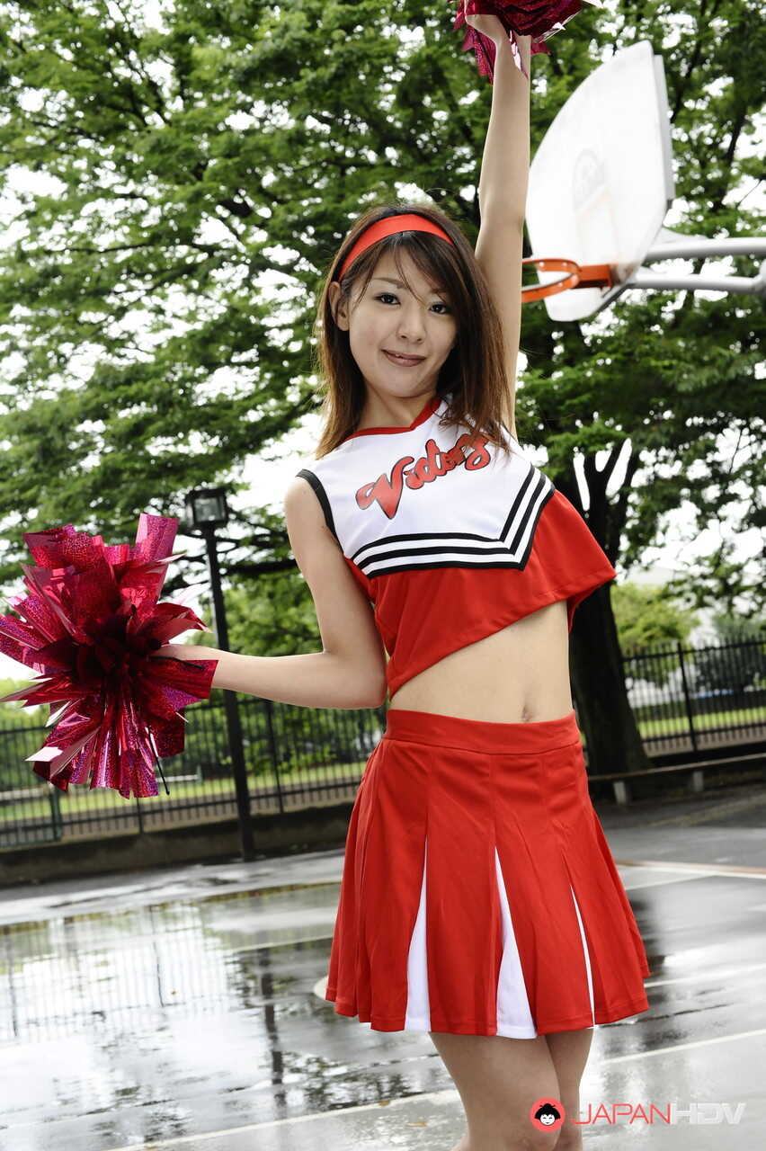 Japanese Cheerleader Tomomi Matsuda Shows Off Her Sexy Legs In A Short Skirt At The Playground