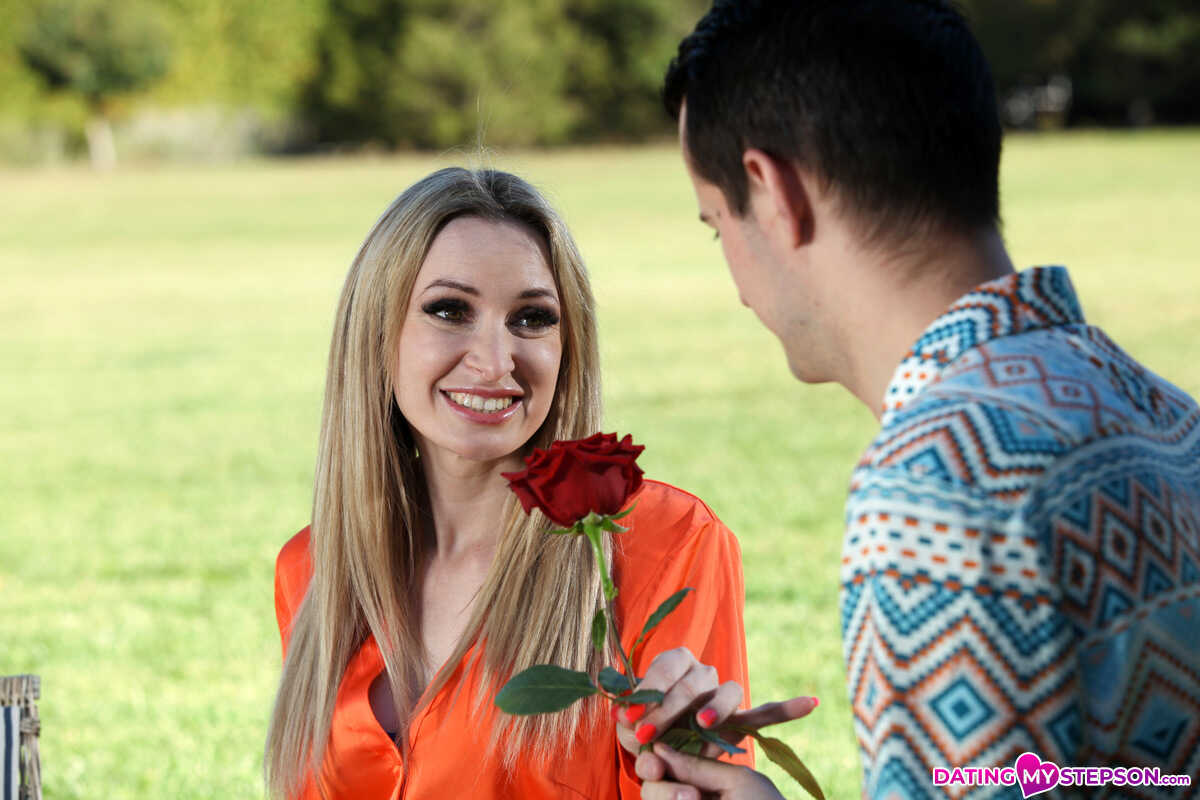 Micky Muffin receives a red rose as her lover Sam Bourne approaches from behind and enters her in passionate fashion. - Mi...