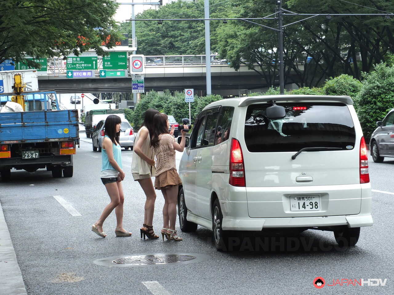 Japanese MILFs Shiori, Nozomi and Yuuko give a CFNM blowjob to a motorist after flashing their pussies in public