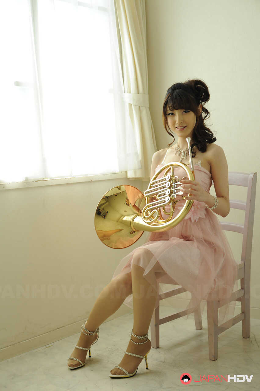 Japanese Goddess Kanako Iioka's Seductive Nude Photoshoot with a French Horn