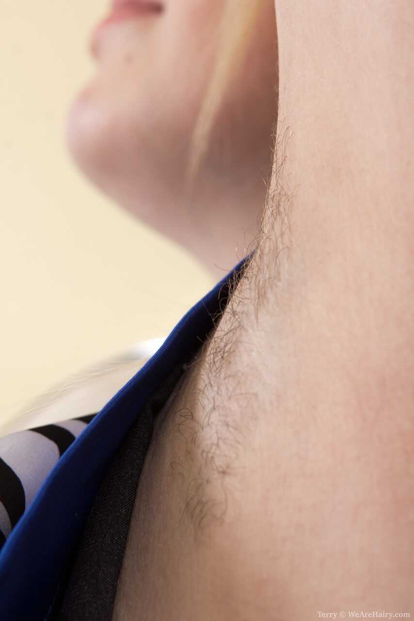 Hairy female Terry shows her big saggy tits loose before stretching her bush wide open and playing with her own hairy puss...