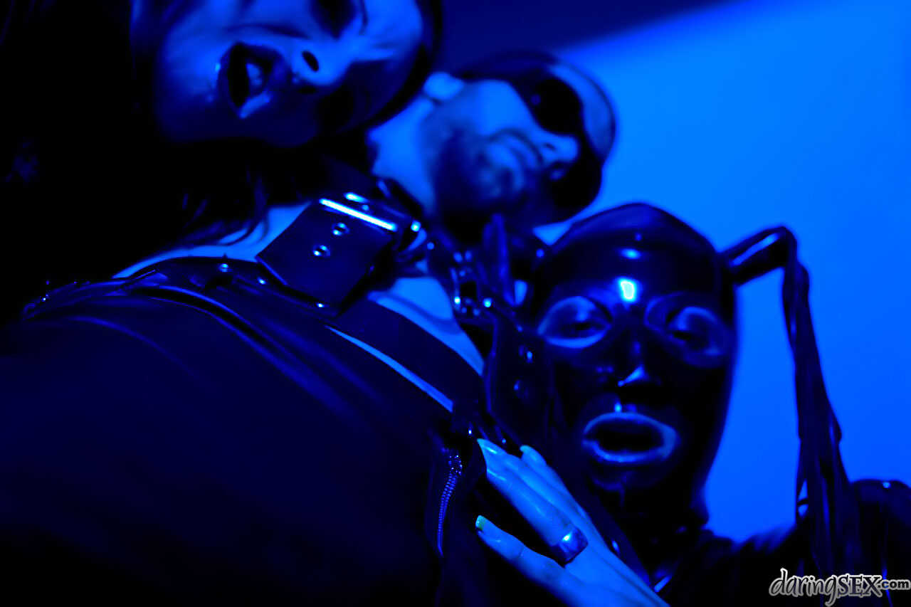Dark haired Daisy Rock bends over in her latex attire, ready to take a big cock in her tight asshole. - Daisy Rock