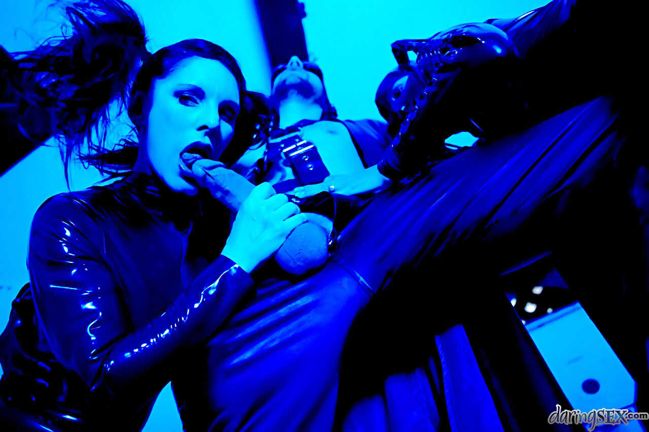 Dark haired Daisy Rock bends over in her latex attire, ready to take a big cock in her tight asshole. - Daisy Rock