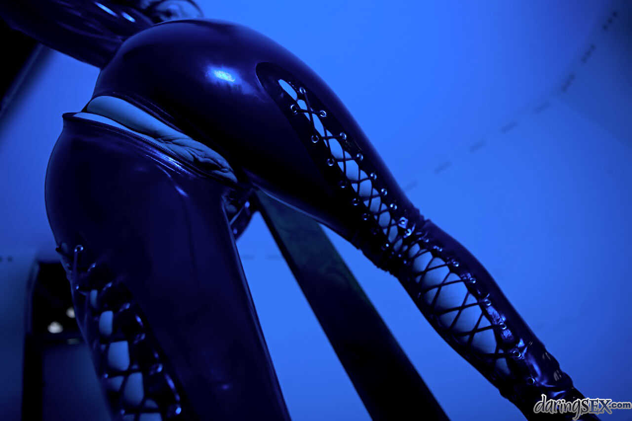 Dark haired Daisy Rock bends over in her latex attire, ready to take a big cock in her tight asshole. - Daisy Rock