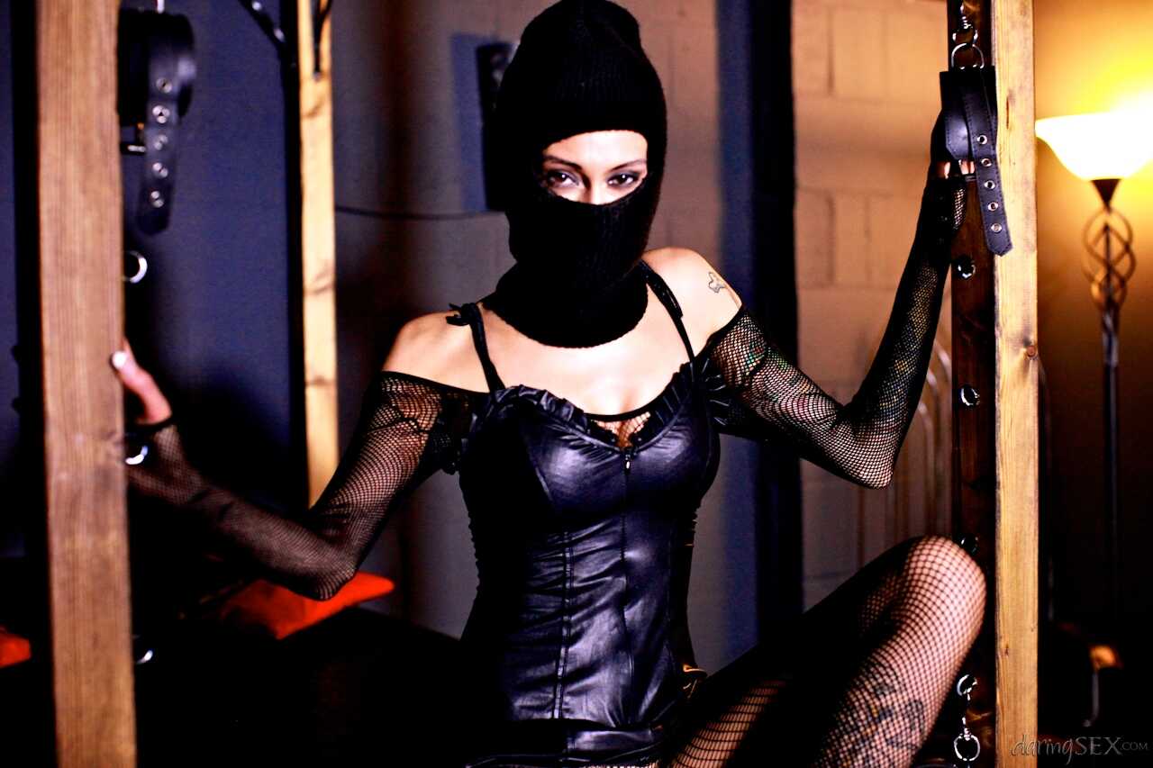 Dark-haired femme fatale Havana Sin outfits her dark-haired men friends in gas masks while wearing lingerie and pantyhose....