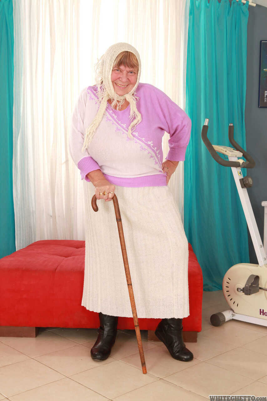 Wrinkled Granny Sara G Slips out of Her Skirt and Boots to Show Off Her Huge Tits in a Bra - Sara G