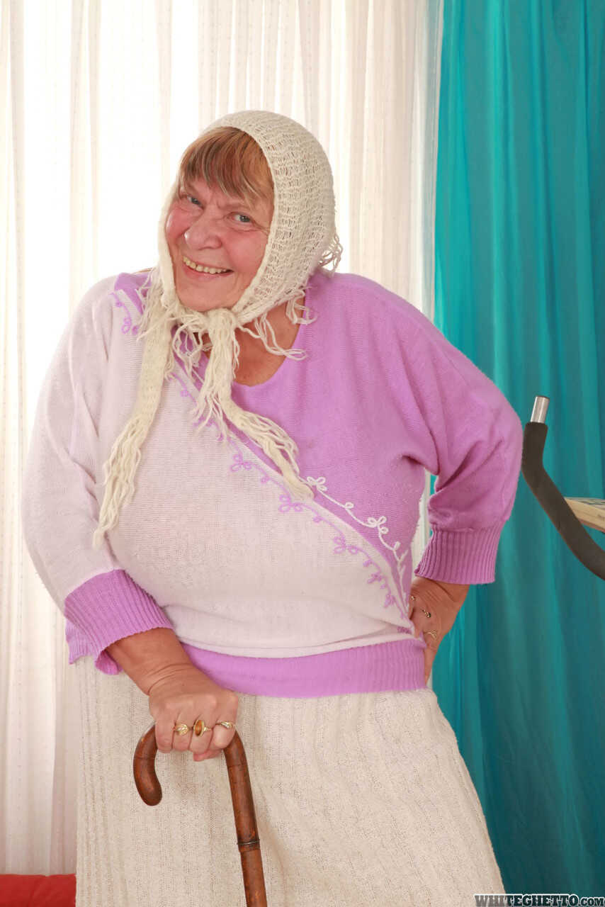 Wrinkled Granny Sara G Slips out of Her Skirt and Boots to Show Off Her Huge Tits in a Bra - Sara G