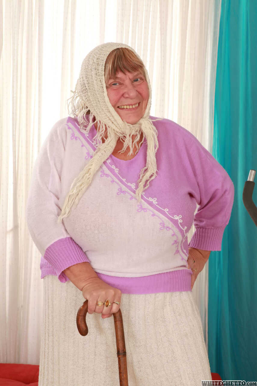 Wrinkled Granny Sara G Slips out of Her Skirt and Boots to Show Off Her Huge Tits in a Bra - Sara G