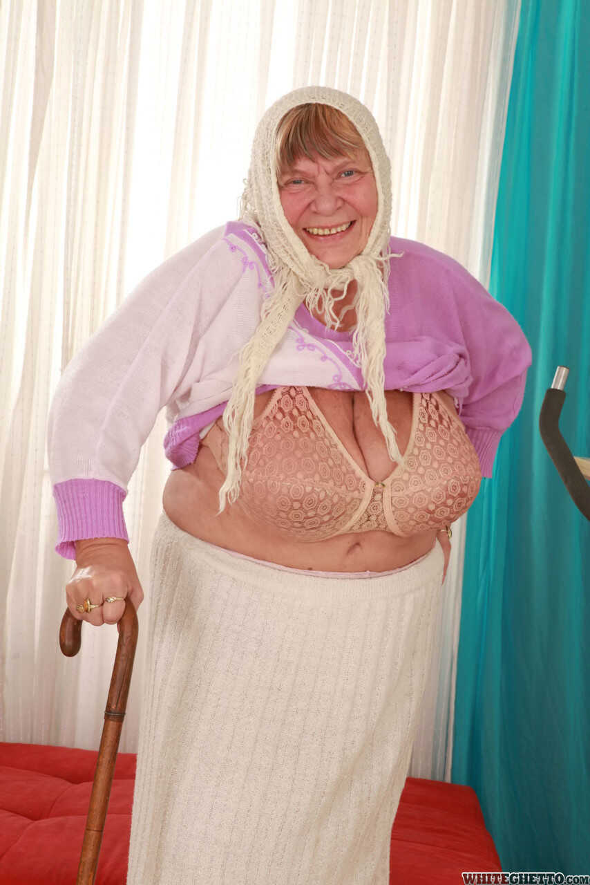 Wrinkled Granny Sara G Slips out of Her Skirt and Boots to Show Off Her Huge Tits in a Bra - Sara G