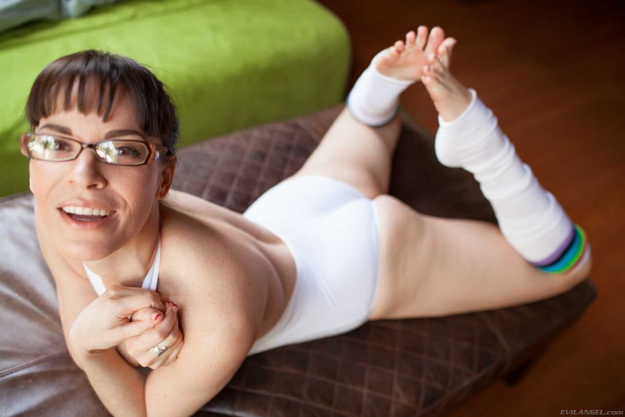 Nerdy Dana DeArmond flexes her pink twat from onesie in leg warmers while freaking out to nerdy music