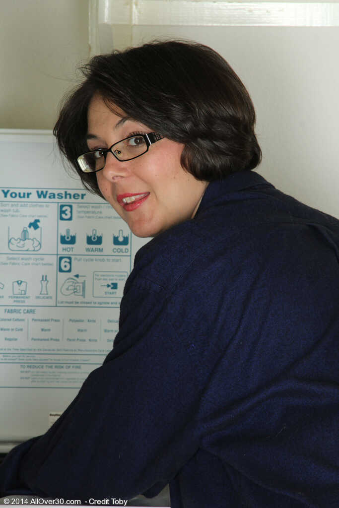 Carlita Johnson's Socked-Off Sojourn: A Mature Housewife Disrobes in the Laundry Room - Carlita Johnson