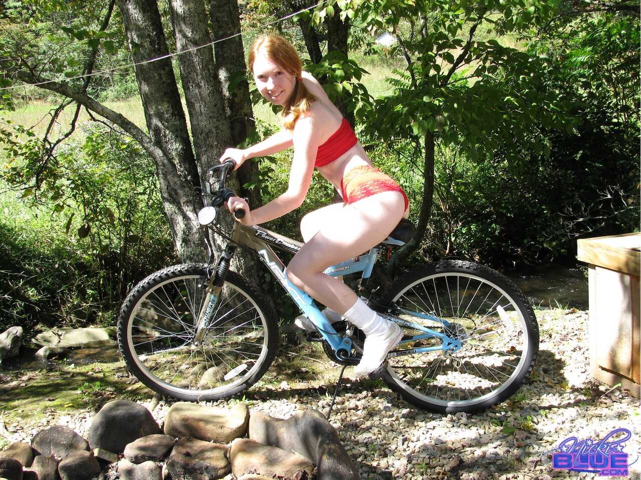 Sexy Redhead Nicki Blue Rides Her Bike with a Barely Covered Bush!