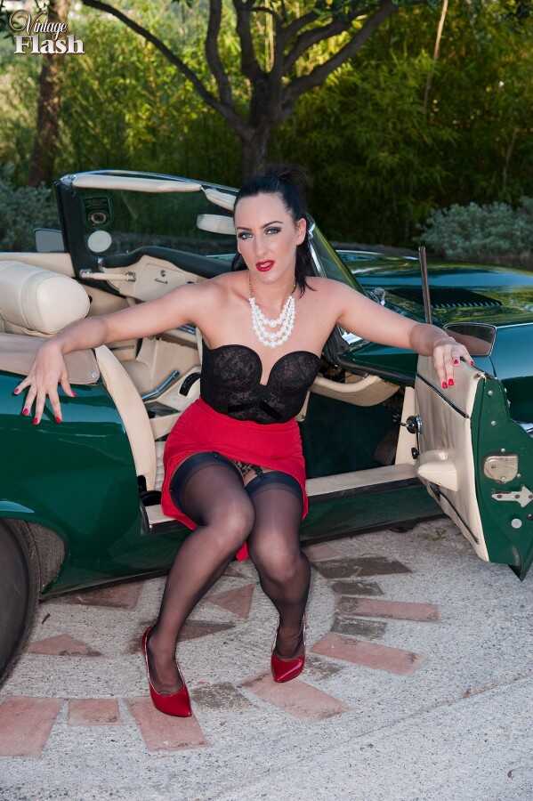 British bombshell Chloe Lovette strips down to vintage nylons and flashes her pussy over a classic sports car - Chloe Lovette