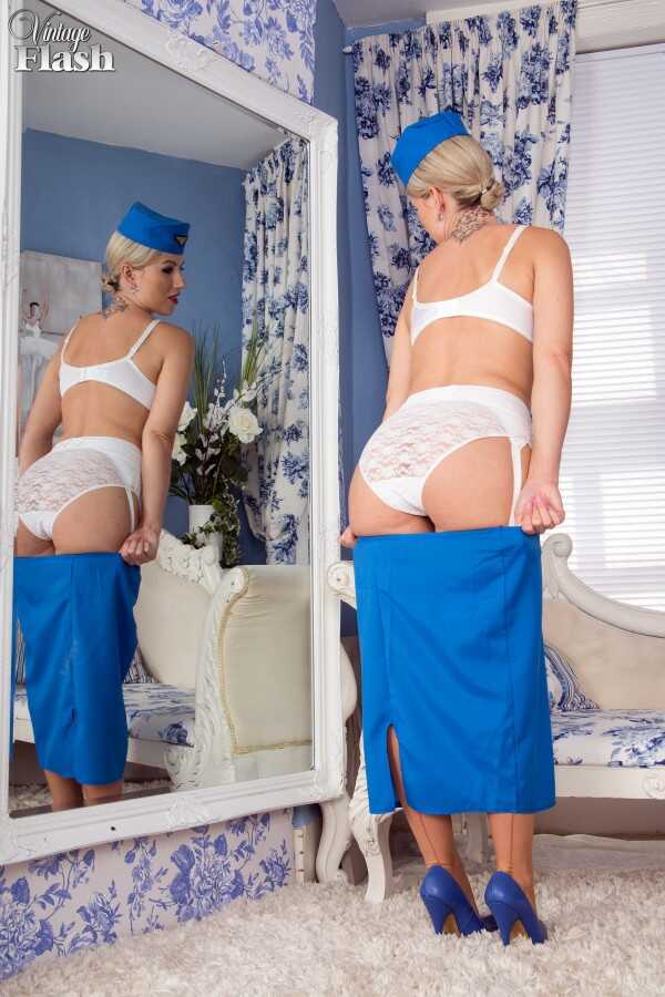 Stewardess Strips Her Vintage Uniform to Show off her Big MILF Ass in Stockings and Garter! - Evey