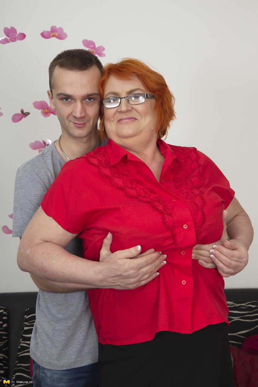 Redheaded MILF and her young boyfriend start to undress as they engage in foreplay. - Jara W
